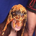 girl_trapped_in_stocks_and_sploshed_004